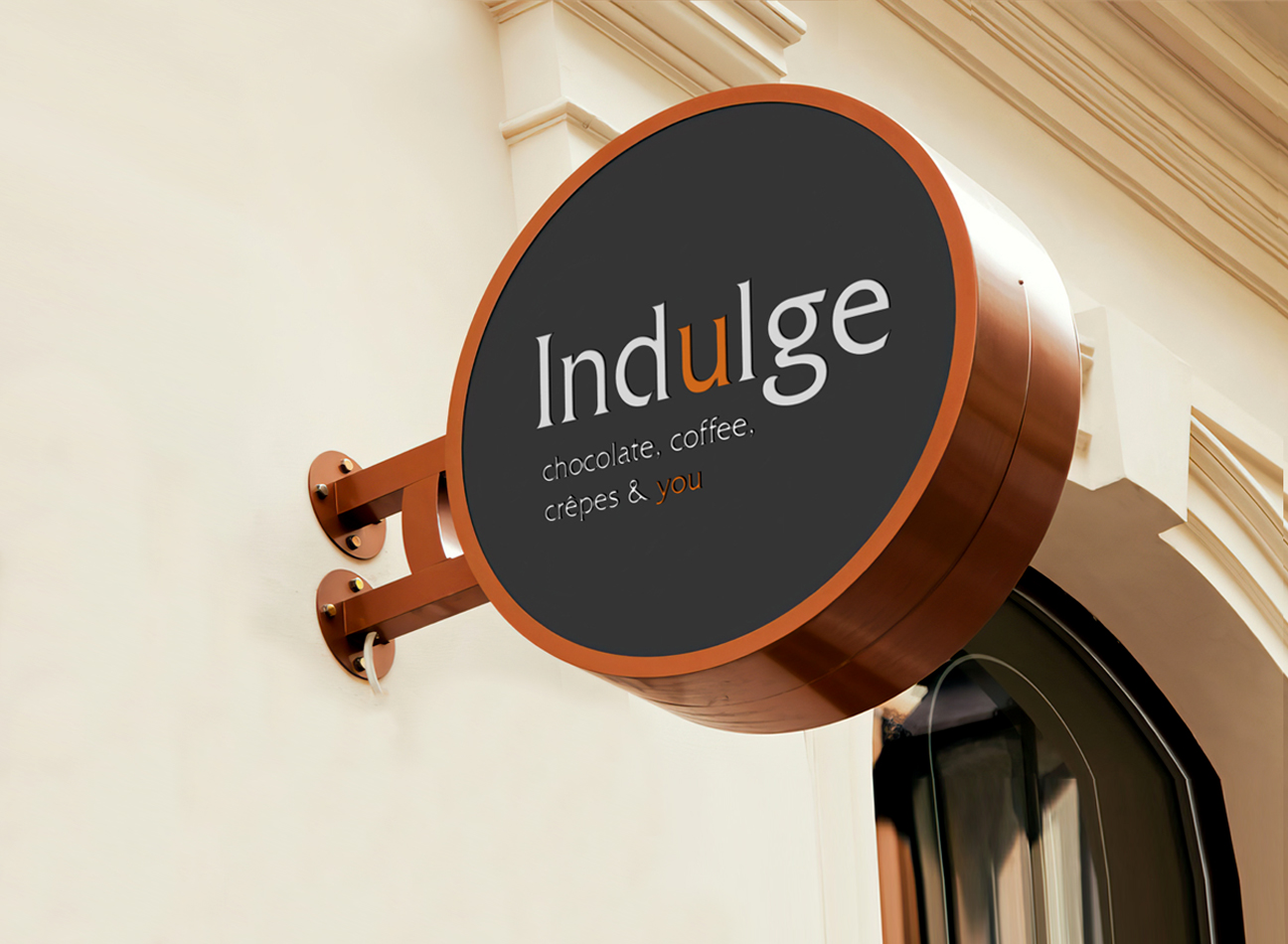 Round signage with the logo design for indulge in brow white and orange