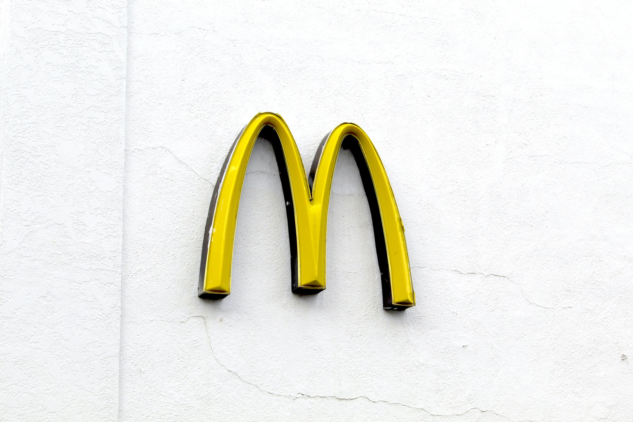 Large Mac donalds M sign on a wall