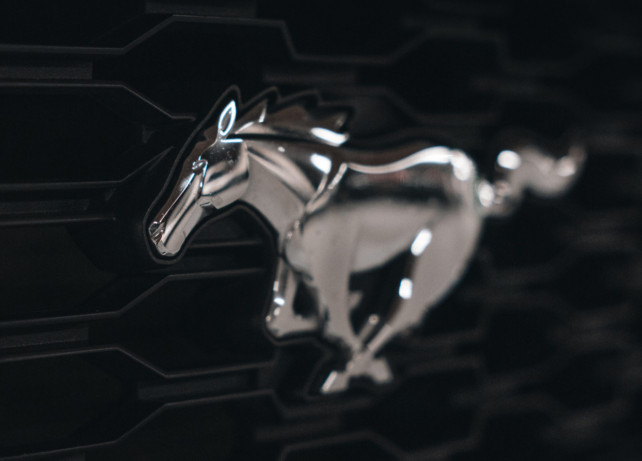 Logo design of a Horse running in a chrome finish